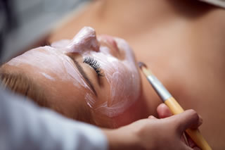 A woman having a facial in a spa