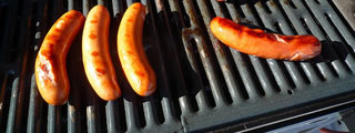Sausages cooking on barbecue Sausages cooking on barbecue