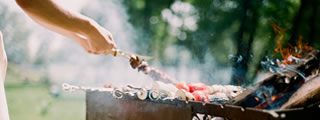 Barbecue chef preparing kebabs Barbecue chef preparing kebabs