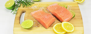 Salmon steaks on chopping board Salmon steaks on chopping board
