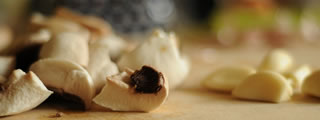 Mushrooms on chopping board Mushrooms on chopping board
