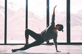 Yoga pose in front of mountains Yoga pose in front of mountains