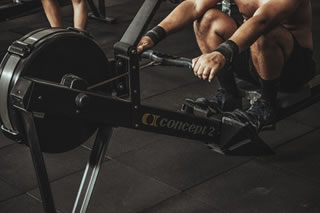 rowing machine and man rowing machine and man