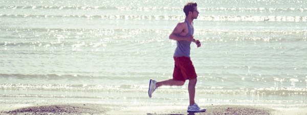 man jogging on beach - Image credit Kate Hiscock (Flickr)