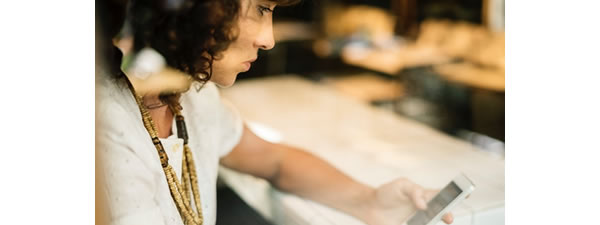 unhappy woman using mobile phone
