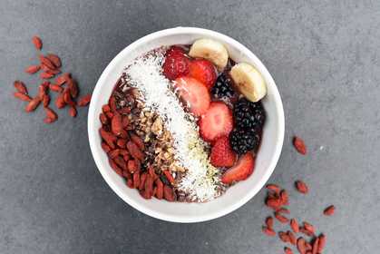 assorted sliced fruits in white bowl