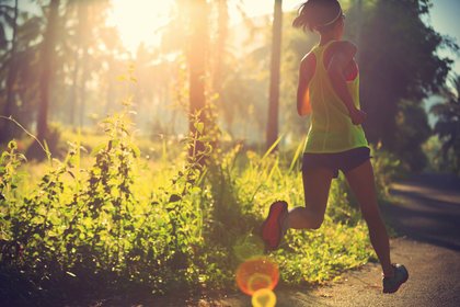 Woman running in woods