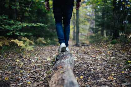 man walking in forest