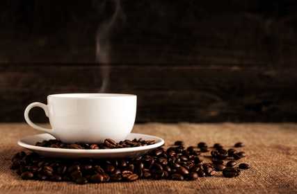 Coffee in a mug and coffee beans