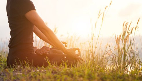 Meditating outdoors