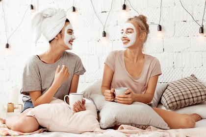 Two women with face masks on