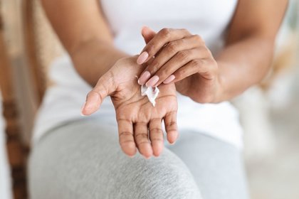 Lady applying cream