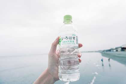 A water bottle being held up