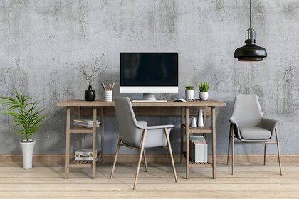 Wooden desk in a grey room