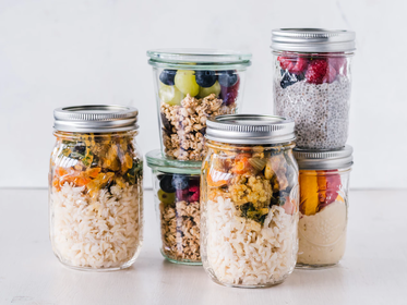 a variety of jars with meals prepared in them