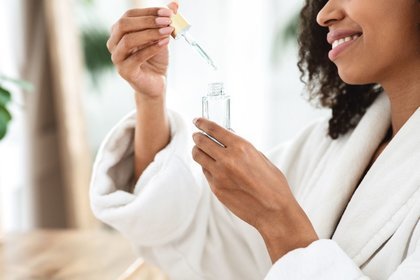 Lady applying serum