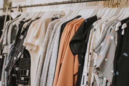 Neutral clothing hanging on a rail