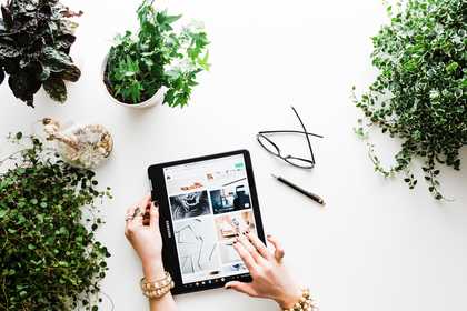 Woman scrolling on a tablet